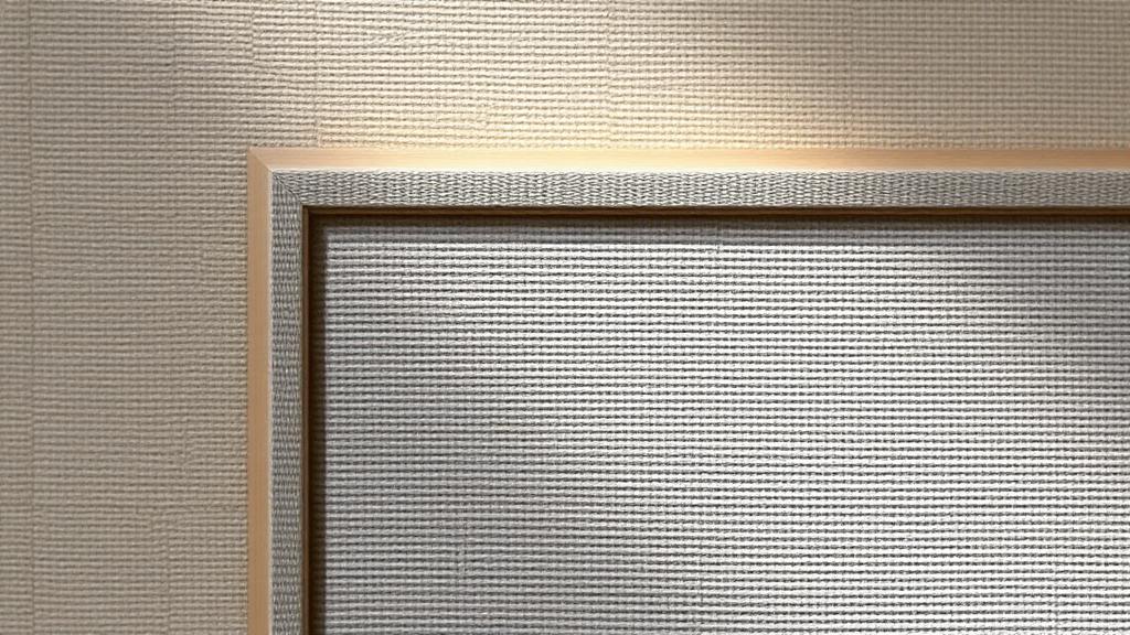 Softly lit canvas texture and frame edge representing art sales